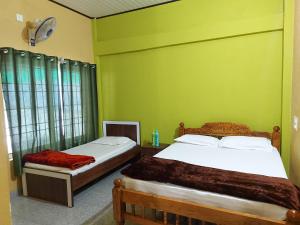 Postel nebo postele na pokoji v ubytování Prestige Nature Homestay Chikmagalur + 35 fotografií