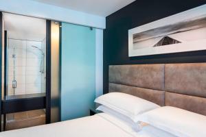 Posteľ alebo postele v izbe v ubytovaní Four Points by Sheraton Auckland