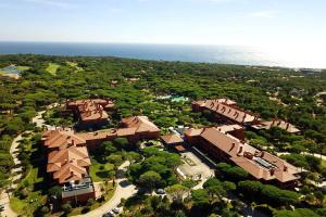 an overhead view of a house with trees and the ocean at Sheraton Cascais Resort - Hotel & Residences in Cascais