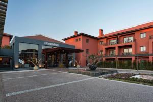 an empty parking lot in front of a building at Sheraton Cascais Resort - Hotel & Residences in Cascais