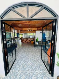 an open door of a house with a room at South Pearl Villas  +134 photos