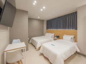 Voodi või voodid majutusasutuse Hotel Leo Changwon Central Branch toas