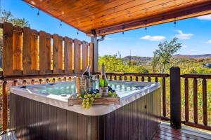 a hot tub on the deck of a house at Indoor Pool, Volleyball Beach, Mountain View, Luxury in Gatlinburg