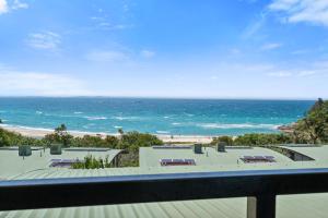 a view of the beach from a balcony at Claytons 7 by Discover Stradbroke in Point Lookout