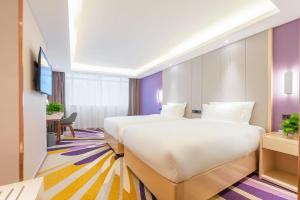 Postel nebo postele na pokoji v ubytování Lavande Hotel Beijing Tiananmen Square Wangfujing Street Branch