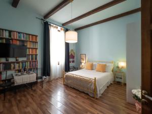 A bed or beds in a room at Affittacamere Firenze in Libertà Parterre