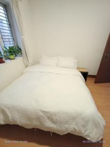 Rúm í herbergi á Cocina Mitho Chha BNB