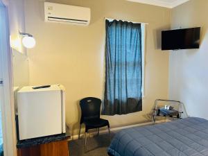 TV a/nebo společenská místnost v ubytování Merrylees Hotel