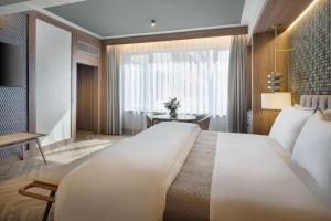 Postel nebo postele na pokoji v ubytování The Westin Madrid Cuzco