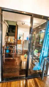 a view of a living room with a large glass window at Bayview Apartment with Balcony in El Nido