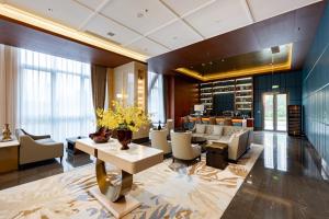 Posezení v ubytování Jian Guo Hotel Yantai Phoenix Building