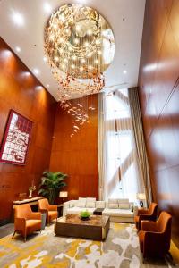 Posezení v ubytování Jian Guo Hotel Yantai Phoenix Building