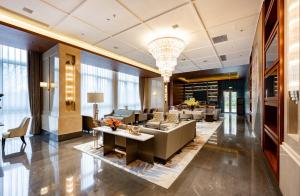 Posezení v ubytování Jian Guo Hotel Yantai Phoenix Building