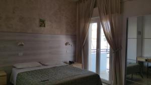 Postel nebo postele na pokoji v ubytování Hotel Canasta + 37 fotografií