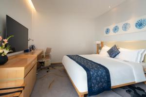 TV i/ili multimedijalni sistem u objektu 石家庄华强诺华廷酒店 Novlion hotel