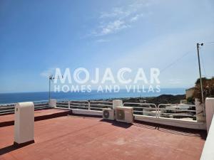 a sign that reads mucaza homes and villas at Apartment Dreaming with Art - Mojacar Pueblo in Mojácar