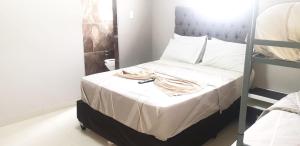 a bedroom with a bunk bed with a towel on it at PEACE LODGE in Cape Town