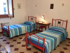 En eller flere senge i et værelse på Scicli Amore Mio
