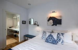 Ένα ή περισσότερα κρεβάτια σε δωμάτιο στο Muramar Beach House