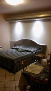 A bed or beds in a room at Parco Sogni d'Oro