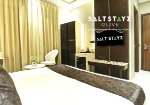 Postel nebo postele na pokoji v ubytování Saltstayz Select - Pitampura