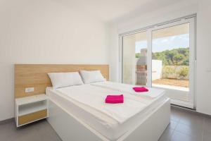 En eller flere senge i et værelse på Apartments at Villa Frida + 14 billeder