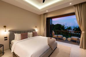 a bedroom with a large bed and a large window at Villa Divano - by Sublime Samui Villas in Choeng Mon Beach +34 photos