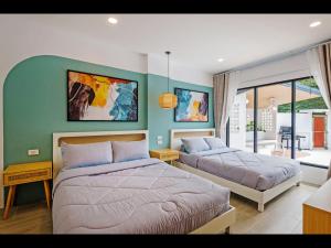 Postel nebo postele na pokoji v ubytování Oasis 4BR Private Pool Villa in central Ao Nang