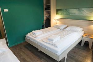 Postel nebo postele na pokoji v ubytování MEININGER Hotel Amsterdam City West
