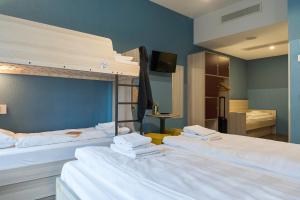 Postel nebo postele na pokoji v ubytování MEININGER Hotel Amsterdam City West