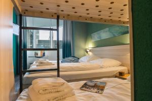 Postel nebo postele na pokoji v ubytování MEININGER Hotel Amsterdam City West