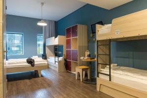 Postel nebo postele na pokoji v ubytování MEININGER Hotel Amsterdam City West