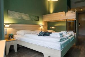 Postel nebo postele na pokoji v ubytování MEININGER Hotel Amsterdam City West