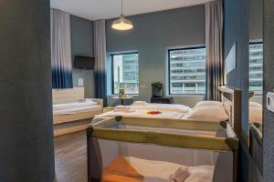 Postel nebo postele na pokoji v ubytování MEININGER Hotel Amsterdam City West