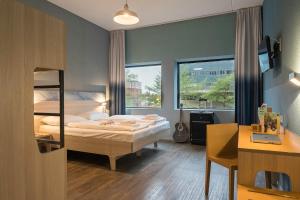 Postel nebo postele na pokoji v ubytování MEININGER Hotel Amsterdam City West