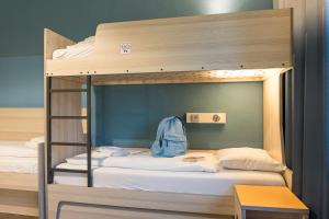 Postel nebo postele na pokoji v ubytování MEININGER Hotel Amsterdam City West