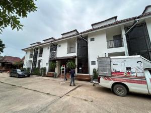 a man standing in front of a house at ปริญศิริ เพลส2 in Phrae