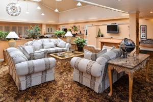 a living room with two couches and a tv at Fremont Inn in Lakeview