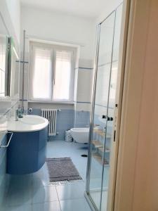 a bathroom with a tub and a sink and a toilet at Alloggio Vimercati 45 in Rome
