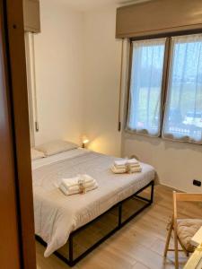 Ένα ή περισσότερα κρεβάτια σε δωμάτιο στο ViaDante57-Autodromo di Monza, Villa Reale, Università Bicocca, Ospedale San Gerardo