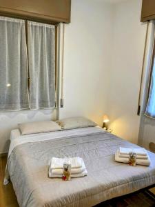 Ένα ή περισσότερα κρεβάτια σε δωμάτιο στο ViaDante57-Autodromo di Monza, Villa Reale, Università Bicocca, Ospedale San Gerardo