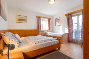 Postel nebo postele na pokoji v ubytování Stierlhof Ritten