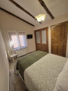 Łóżko lub łóżka w pokoju w obiekcie Casa Rural Rincón