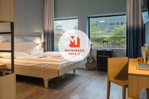 Postel nebo postele na pokoji v ubytování MEININGER Hotel Amsterdam City West