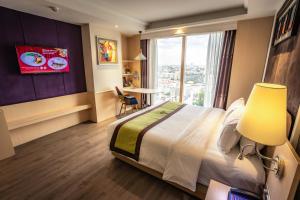 Letto o letti in una camera di The Bazaar Hotel Bangkok
