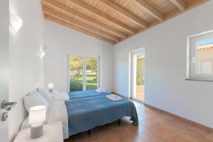 a white bedroom with a bed and a window at Paraiso da Serva - Flor do Rosto 2 in Odemira +28 photos