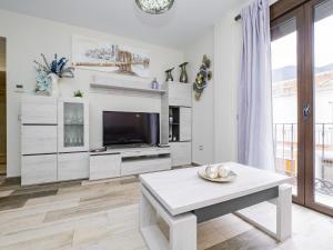 Televízia a/alebo spoločenská miestnosť v ubytovaní Cubo's Urban Suite Town Centre
