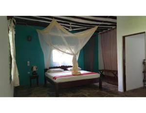 Postel nebo postele na pokoji v ubytování Watamu Eco Villas