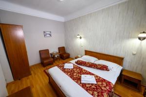 Postel nebo postele na pokoji v ubytování Hotel Transilvania