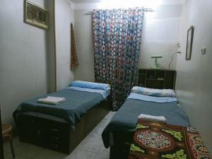 Un pat sau paturi într-o cameră la david hostel